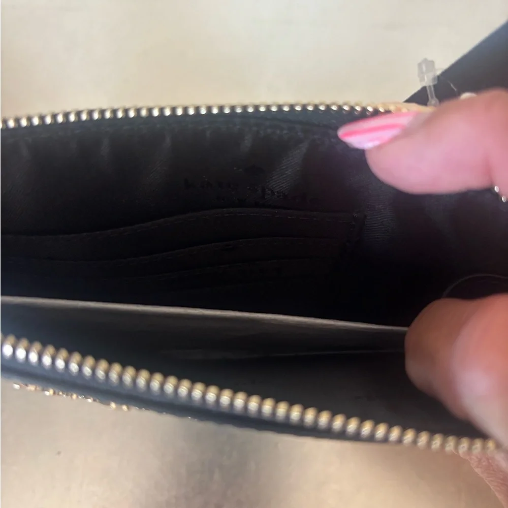 kate spade black leather wristlet with gold logo
